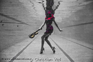 Samantha playing with her violin underwater. by Christian Vizl 